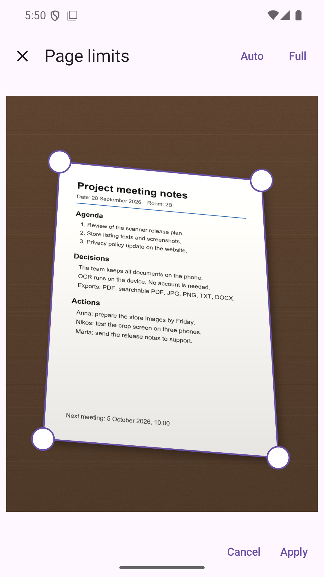 DocScanner Page limits screen: the app outlines a page of meeting notes on a desk, with a handle on each corner